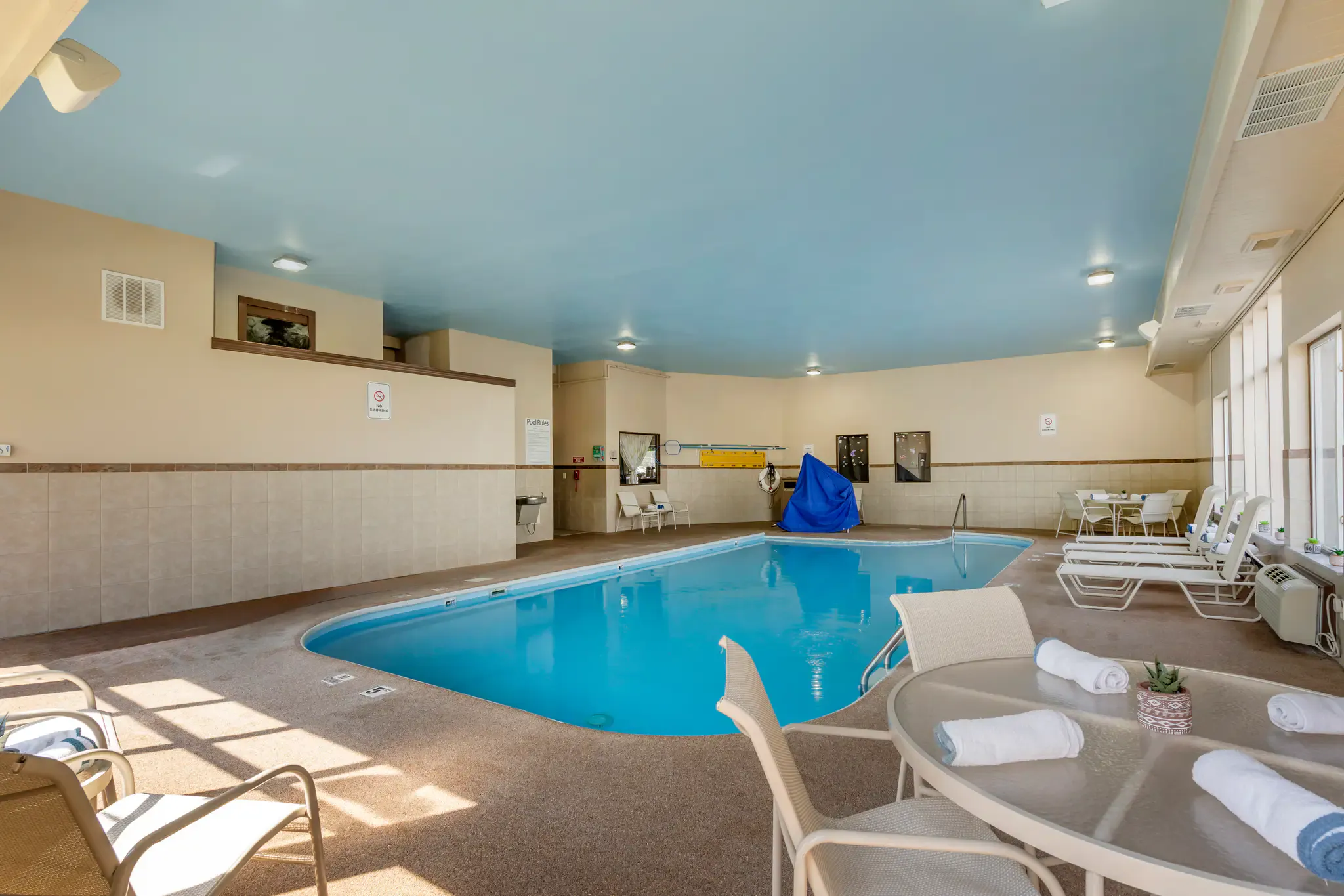 Indoor heated pool seating and lounge area